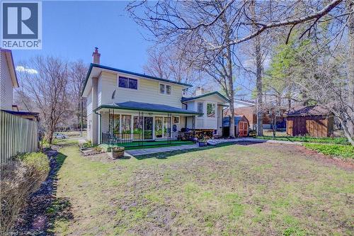 Rear view of house featuring a shed, a chimney, and brick siding - 564 Glen Manor Boulevard, Waterloo, ON - Outdoor With Deck Patio Veranda