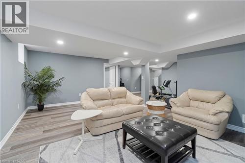 This versatile space features light-colored walls, recessed lighting, and durable flooring, suitable for various uses - 4 Macbean Crescent, Waterdown, ON - Indoor