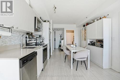 A814 - 3210 Dakota Common, Burlington, ON - Indoor Photo Showing Kitchen With Double Sink