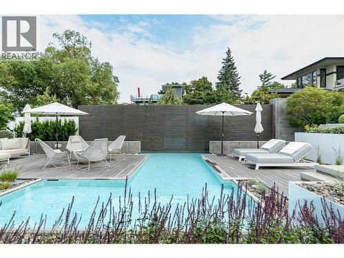 Multiple sitting areas around the plunge pool - 4110 Lakeshore Road, Kelowna, BC - Outdoor With In Ground Pool