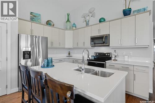 687 Secord Bend, Saskatoon, SK - Indoor Photo Showing Kitchen With Double Sink With Upgraded Kitchen