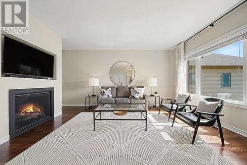 7 Senators Gate Drive, Perth, ON - Indoor Photo Showing Living Room With Fireplace