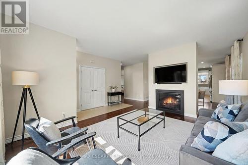 7 Senators Gate Drive, Perth, ON - Indoor Photo Showing Living Room With Fireplace