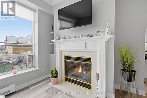 310 - 250 Sydenham Street, London East (East B), ON - Indoor With Fireplace