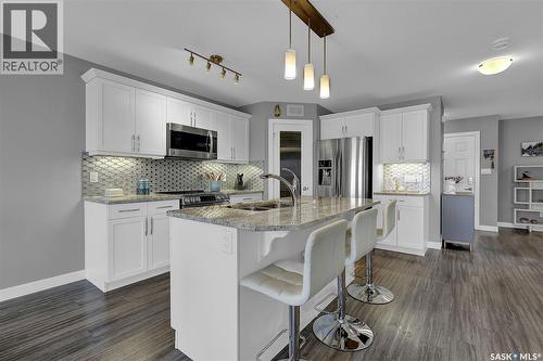 8933 Kestral Drive, Regina, SK - Indoor Photo Showing Kitchen With Double Sink With Upgraded Kitchen