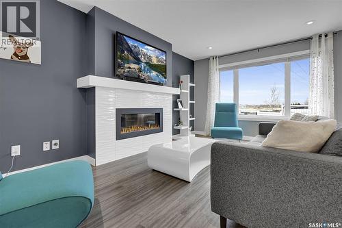 8933 Kestral Drive, Regina, SK - Indoor Photo Showing Living Room With Fireplace