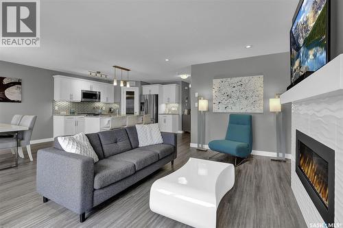 8933 Kestral Drive, Regina, SK - Indoor Photo Showing Living Room With Fireplace