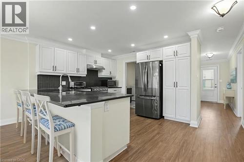 this photo is virtually staged - 22 Sister Kern Terrace, Hamilton, ON - Indoor Photo Showing Kitchen With Double Sink With Upgraded Kitchen