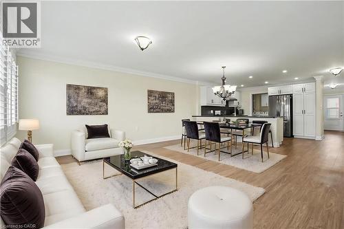 this photo is virtually staged - 22 Sister Kern Terrace, Hamilton, ON - Indoor Photo Showing Living Room