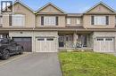 Traditional-style house featuring stone siding, stucco siding, a porch, and an attached garage - 91 Chamomile Drive, Hamilton, ON  - Outdoor With Facade 