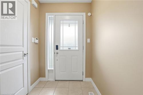 Entryway featuring tile patterned flooring and baseboards - 91 Chamomile Drive, Hamilton, ON - Indoor Photo Showing Other Room