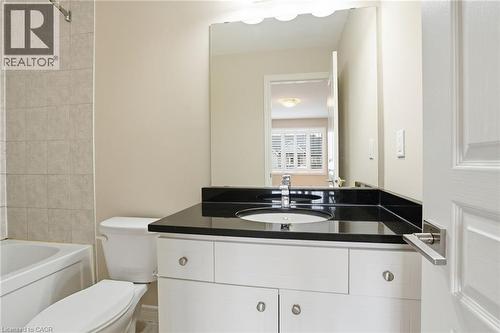 Ensuite Bathroom featuring vanity and shower / bathtub combination - 91 Chamomile Drive, Hamilton, ON - Indoor Photo Showing Bathroom