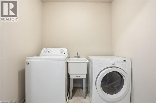 Laundry room featuring independent washer and dryer - 91 Chamomile Drive, Hamilton, ON - Indoor Photo Showing Laundry Room