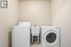 Laundry room featuring independent washer and dryer - 