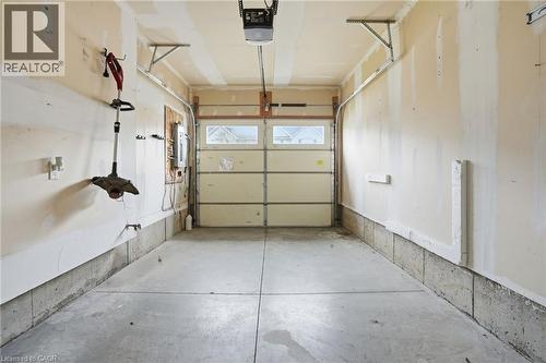 Garage featuring a garage door opener - 91 Chamomile Drive, Hamilton, ON - Indoor Photo Showing Garage