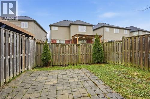 Fenced backyard with a residential view and a patio - 91 Chamomile Drive, Hamilton, ON - Outdoor