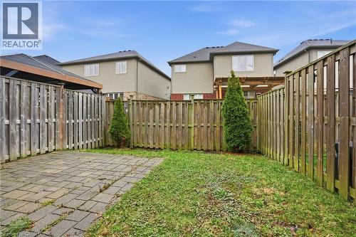 Fenced backyard featuring a patio area and a residential view - 91 Chamomile Drive, Hamilton, ON - Outdoor