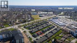 Aerial view of the property, highlighted in red, situated within a development of similar properties - 