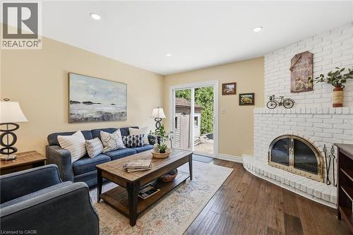 Sliding Doors to Back Yard - 2648 Cavendish Drive, Burlington, ON - Indoor Photo Showing Living Room With Fireplace
