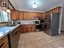 119 Montgomery Crescent, Weyburn, SK  - Indoor Photo Showing Kitchen With Double Sink 
