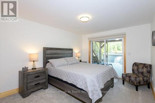 Second Bedroom with walkout - 149 John Buchler Road, Georgian Bay (Baxter), ON - Indoor Photo Showing Bedroom