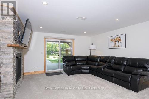 Family Room with Walk out to pool and Lake - 149 John Buchler Road, Georgian Bay (Baxter), ON - Indoor Photo Showing Living Room With Fireplace