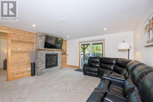 Family Room with Walk out to pool and Lake - 149 John Buchler Road, Georgian Bay (Baxter), ON - Indoor Photo Showing Living Room With Fireplace