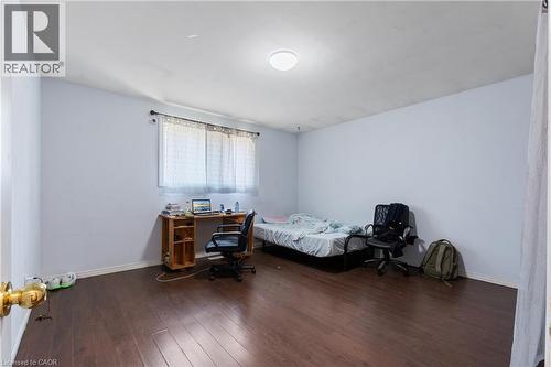 Bedroom featuring hardwood / wood-style flooring and an office area - 23 Amherst Drive, Kitchener, ON - Indoor Photo Showing Bedroom