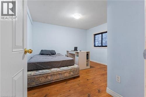 Bedroom with light wood-style floors and baseboards - 23 Amherst Drive, Kitchener, ON - Indoor Photo Showing Bedroom