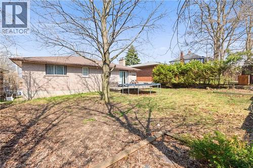 Fenced yard with a trampoline - 23 Amherst Drive, Kitchener, ON - Outdoor