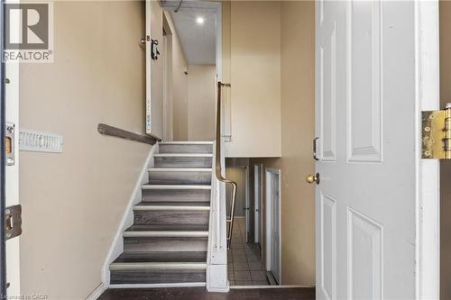Stairs featuring baseboards - 23 Amherst Drive, Kitchener, ON - Indoor Photo Showing Other Room