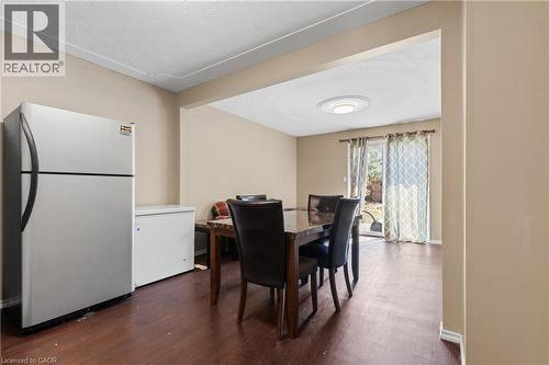 Dining space featuring wood finished floors and baseboards - 23 Amherst Drive, Kitchener, ON - Indoor Photo Showing Dining Room