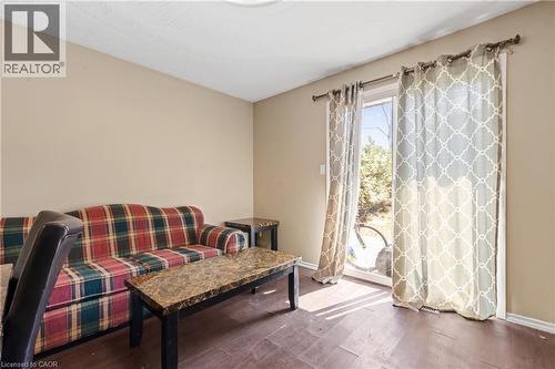 Living area featuring dark wood-style floors - 23 Amherst Drive, Kitchener, ON - Indoor
