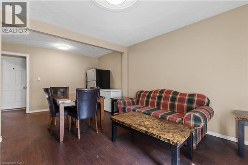 Dining area with baseboards and dark wood-style flooring - 23 Amherst Drive, Kitchener, ON - Indoor