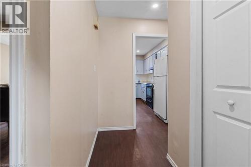 Hallway featuring dark wood-style floors and recessed lighting - 23 Amherst Drive, Kitchener, ON - Indoor Photo Showing Other Room