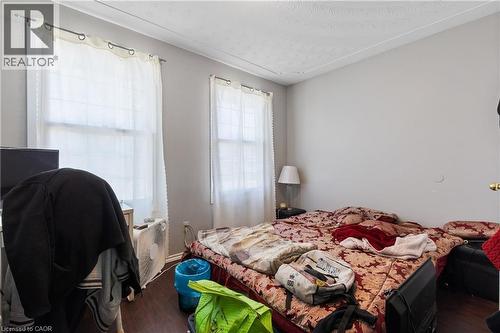 Bedroom with dark wood finished floors and a textured ceiling - 23 Amherst Drive, Kitchener, ON - Indoor Photo Showing Bedroom