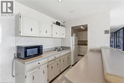 222 Jackson Street W Unit# 606, Hamilton, ON - Indoor Photo Showing Kitchen With Double Sink