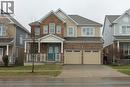 The property features a brick and siding exterior with a covered porch and dual front doors - 40 Compass Trail, Cambridge, ON  - Outdoor With Facade 