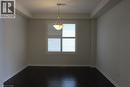 Interior room with dark wood-finish flooring, white baseboards, and neutral wall paint - 40 Compass Trail, Cambridge, ON  - Indoor Photo Showing Other Room 