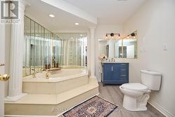Ensuite privy to the 4-piece bathroom. - 