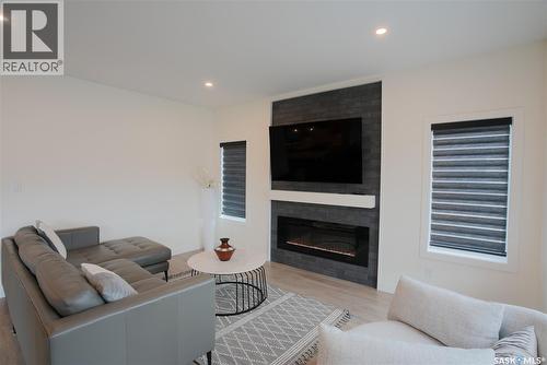 4154 Fieldstone Way, Regina, SK - Indoor Photo Showing Living Room With Fireplace