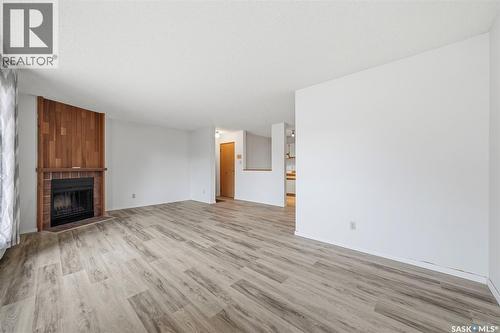 102 385 Kingsmere Boulevard, Saskatoon, SK - Indoor Photo Showing Living Room With Fireplace