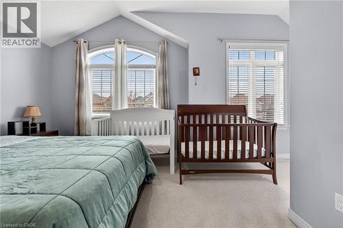 This room features light blue walls, sloped ceilings, and carpeting - 44 Matteo Trail, Hamilton, ON - Indoor Photo Showing Bedroom