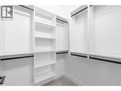Primary bedroom walk-in closet - 