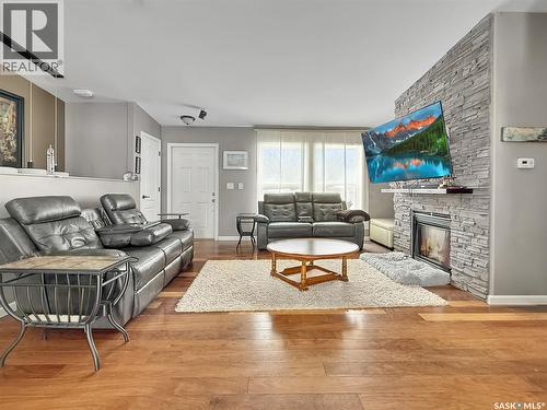 808 Chaplin Street, Swift Current, SK - Indoor Photo Showing Living Room With Fireplace