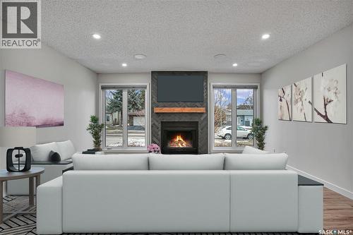 226 Candle Crescent, Saskatoon, SK - Indoor Photo Showing Living Room With Fireplace