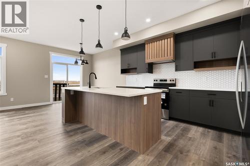 315 Veterans Drive, Warman, SK - Indoor Photo Showing Kitchen With Upgraded Kitchen