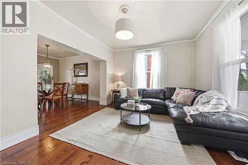 Living area featuring rich hardwood flooring, light-colored walls, and a recessed ceiling light fixture - 30 Grand Avenue, Caledonia, ON 