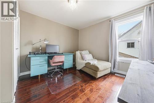 This room features rich hardwood flooring, a window with curtains, and neutral-toned walls - 30 Grand Avenue, Caledonia, ON 