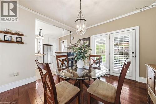 This dining area features hardwood floors and white trim - 30 Grand Avenue, Caledonia, ON - Indoor Photo Showing Dining Room